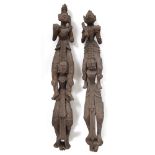 A NEAR PAIR OF TIBETAN STYLE SIAMESE WOODEN CARVED SCULPTURES the largest measures 101cm high