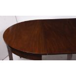 A GEORGE III MAHOGANY D END DINING TABLE standing on square tapering legs complete with three