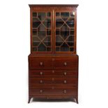 A REGENCY MAHOGANY SECRETAIRE BOOKCASE with glazed doors to the upper section enclosing adjustable