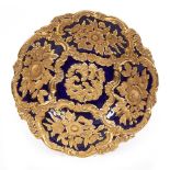A MEISSEN PORCELAIN SERVING BOWL with a cobalt blue ground and raised gilded floral decoration