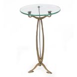 AN ART NOUVEAU STYLE BRASS OCCASIONAL TABLE with a glass top, 38cm diameter x 63cm high At