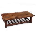 A ZIMBABWEIAN HARDWOOD COFFEE TABLE constructed from old railway sleepers, 141cm wide x 70cm deep