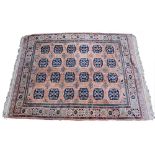 A TURKISH SALMON GROUND WOOLLEN RUG with a geometric decoration, 275cm x 370cm Condition: minor