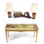 A RECTANGULAR ONYX TOPPED CAST BRASS COFFEE TABLE with square tapering legs together with a pair