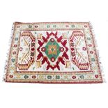 A TURKISH CREAM AND RED GROUND WOOLLEN RUG 283cm x 219cm At present, there is no condition report