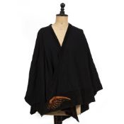 A CHANEL STYLE WOOLLEN PONCHO with ribbed neck together with a woollen black shawl