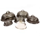 A GRADUATED SET OF FIVE VICTORIAN PEWTER FOOD COVERS by Benet Fink & Co, the largest 48cm wide,