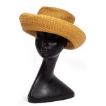 A CIRCULAR STRAW HAT originally purchased from Harvey Nichols, 33cm diameter At present, there is no