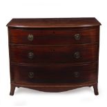 A 19TH CENTURY MAHOGANY BOW FRONTED CHEST OF THREE LONG DRAWERS standing on bracket feet, 110cm wide
