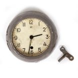 A RUSSIAN GREY PAINTED CAST METAL WALL CLOCK reputedly previously used in a Russian submarine,