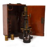 A LATE 19TH / EARLY 20TH CENTURY MICROSCOPE by Swift & Son of Tottenham Court Road, London, with