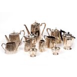 AN OLD SILVER PLATED FOUR PIECE TEA AND COFFEE SERVICE together with a three piece silver plated