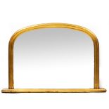 A MODERN VICTORIAN STYLE GILT OVERMANTLE MIRROR with arching top, 119cm wide x 79cm high