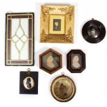 FOUR ANTIQUE WAX PROFILE MINIATURES mounted in various frames; an early 19th century embroidered