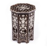 A MIDDLE EASTERN MOTHER OF PEARL AND PEWTER INLAID OCTAGONAL OCCASIONAL TABLE with floral ornament