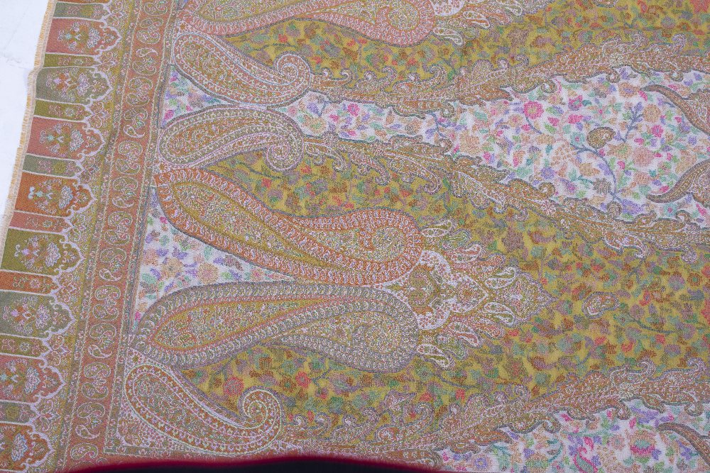 A MODERN INDIAN WOOLLEN SHAWL with green ground and brightly coloured flowers, 213cm long x 97cm - Image 2 of 6