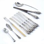 Assortment of silver handled knives silver spoons etc