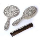 Three piece silver dressing table set foliate decoration, indistinct marks (3)