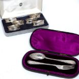 Cased set of six silver napkin rings and a cased silver presentation spoon and fork