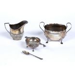 Silver tea strainer and spoon, silver cream jug and a sucrier (3)