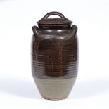 Attributed to Winchcombe Pottery large twin handled storage jar with lid, with incised decoration