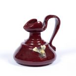 Bretby art pottery jug with applied bee decoration on red ground impressed Bretby sunburst mark