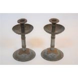 Pair of Arts and Crafts style metal candlesticks, with riveted decoration unsigned 22cm high (2)