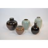Five Chinese inspired studio pottery vases iron and celadon glazed, incised WW monogram to base