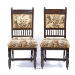 Manner of Edward William Godwin (1833-1886) pair of chairs, later reupholstery 97cm high (2)