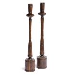 Pair of Cotswold School turned candlesticks walnut, unsigned 34cm high