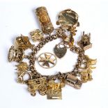 9ct yellow gold charm bracelet and various 9ct gold and yellow metal charms 97g approx overall