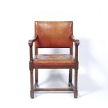 Heals Tilden oak armchair circa 1910 turned supports and legs, and leather upholstered seat 90cm