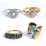 Four gold rings to include: 18ct yellow gold sapphire and diamond ring, cluster ring and two