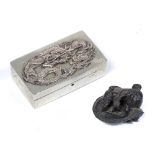 White metal snuff box Chinese with raised dragon to the lid 7cm across and a small bronze weight