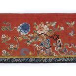 Red silk panel with Peking knot Chinese with central peony, butterflies and other flowers, with