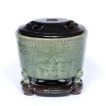 Ming celadon cylindrical potiche/jardiniere Chinese, 15th/16th Century on three lion mask feet,