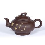 Yixing teapot Chinese, early 20th Century with raised blossom and with circular seal mark 21cm long,