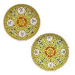 Pair of yellow ground saucer dishes Chinese each with painted bats and long life symbols, Guangxu