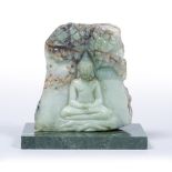Carved jade boulder Thai, 20th Century decorated with a seated figure of Buddha, with a later marble