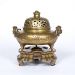 Gilt-flecked bronze censer and cover on stand Chinese, 18th Century cast in low relief with two shou