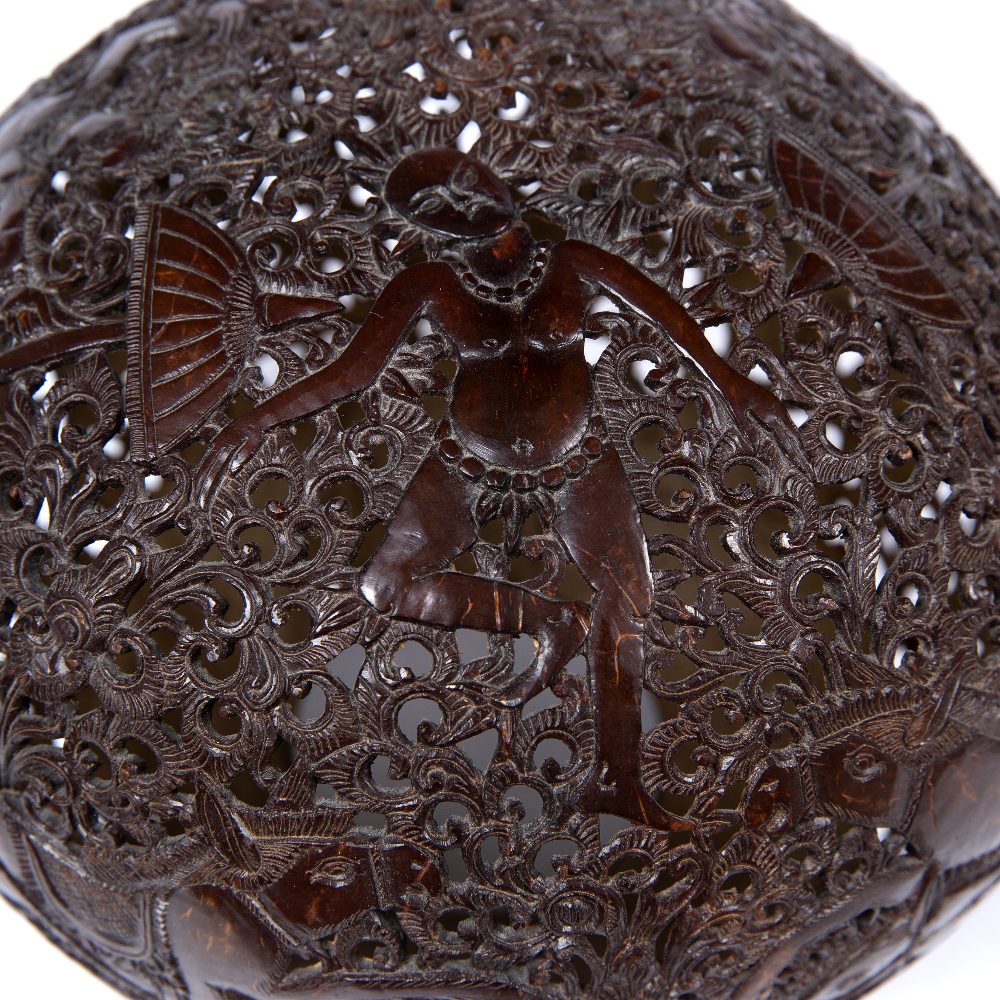 Carved coconut lamp Balinese carved with foliate scrolls and deities. 18cm across - Image 2 of 5