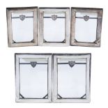 Five export silver picture frames Chinese, 19th Century of rectangular form, each with a shaped