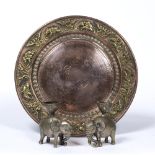 Copper plate Indian decorated to the border with repeating embossed decoration of elephants 23.5cm