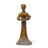 Treacle glazed tomb figure Chinese, Tang style the female figure holding a lute 21cm high