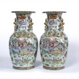 Pair of Canton polychrome vases Chinese,19th Century each painted with a panel of courtiers,within a