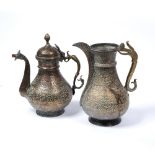 Two Islamic ewers both engraved with band of arabesques and palmettes 30.5cm high, 28cm high (2)