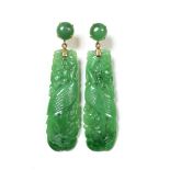 Pair of yellow metal mounted jade earrings depicting birds amongst leaves, butterfly backs,