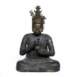 Wood sculpture of a seated Buddha Tibetan, 17th/18th Century holding the left index finger cupped in