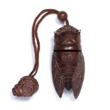 Wood Inro in the form of a cicada Japanese 20th Century the carved insect with inset bone eyes, with