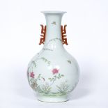 Bottle vase Chinese delicately painted in famille rose enamels depicting a rocky outcrop with